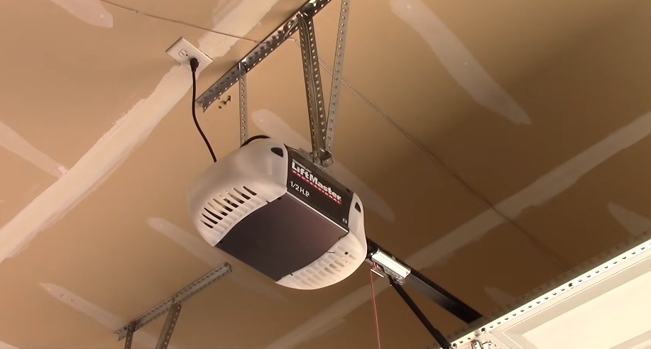Ceiling-mounted garage door opener and rail