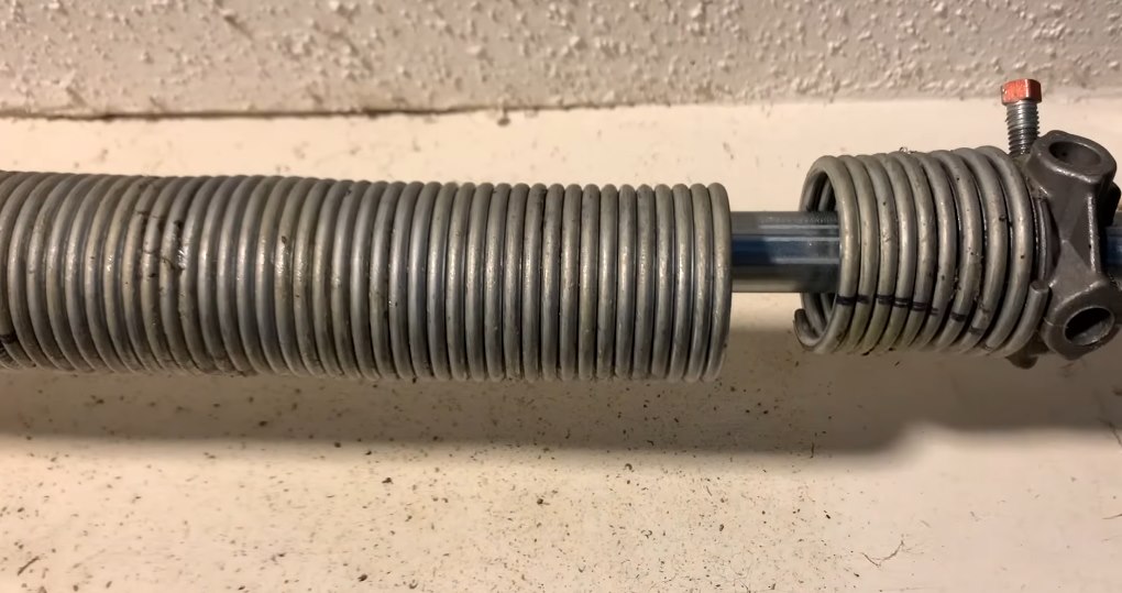 Separated garage door torsion spring on a shaft